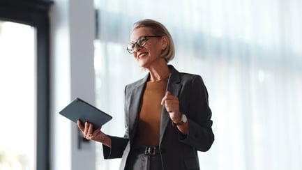 consulting-senior-woman-with-tablet-speaking