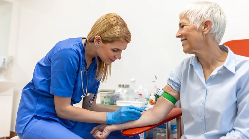 esm-healthcare-nurse-taking-blood-from-elderly
