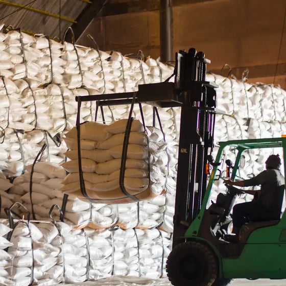 industry-forklift-bags-of-produce-lifting-warehouse-square