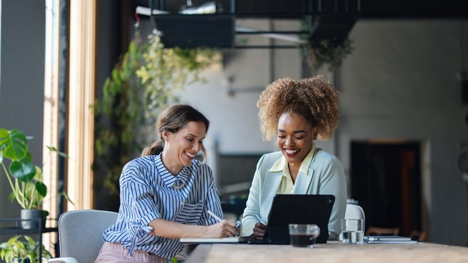 Two business women using Serviceware software in an office