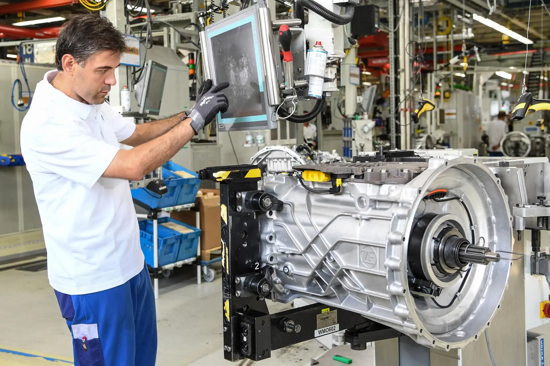 man working in a car factory