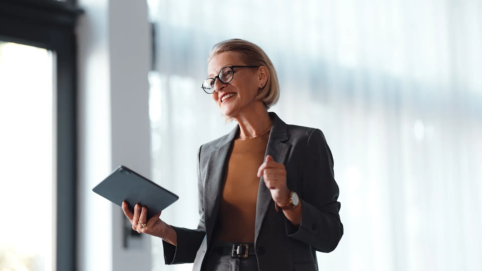 woman leader smiling while working with notepad