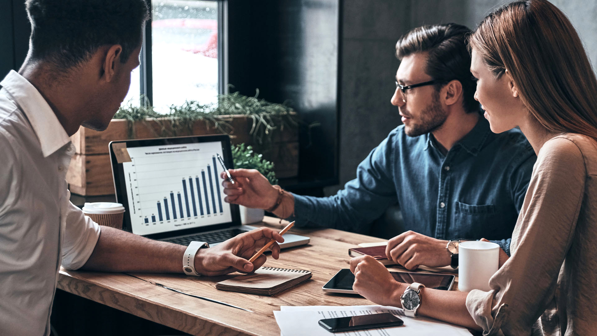 office workers looking at database chart